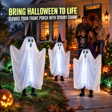Family viewing three illuminated ghost decorations on a Halloween porch
